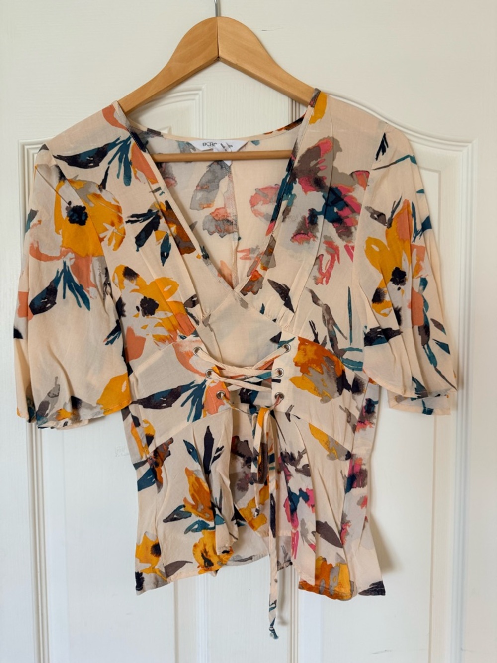 BCBGeneration Cream Floral Lace-Up V-Neck Blouse with Yellow Accents
